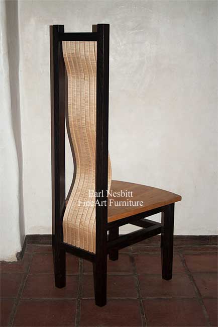 custom made comfortable dining chair showing curve of curly maple bent laminate slats